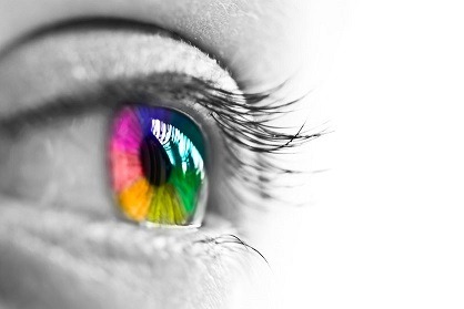 32988581 – girl colorful and natural rainbow eye on white background